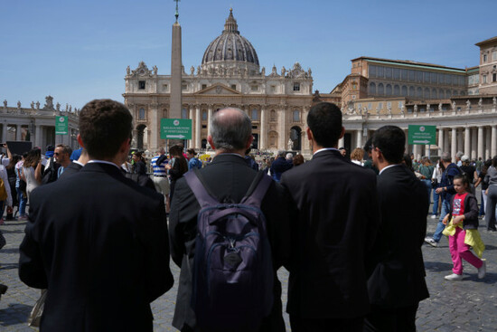 priests-stand-in-st-peters-square-at-the-vatican-after-cardinal-camerlengo-kevin-joseph-farrell-announced-the-death-of-pope-francis-monday-april-21-2025-ap-photoandrew-medichini