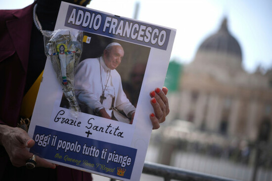 a-woman-holds-a-picture-of-pope-francis-reading-in-italian-farewell-francis-thank-you-his-holiness-today-all-the-people-cry-for-you-in-st-peters-square-at-the-vatican-after-cardinal-camerlengo-k