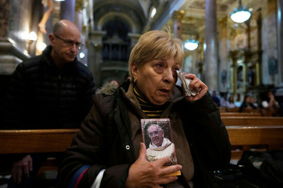maria-teresa-delgado-holds-a-portrait-of-the-late-pope-francis-during-mass-at-the-basilica-de-san-jose-de-flores-where-he-worshipped-as-a-youth-following-the-vaticans-announcement-of-his-death-in-b