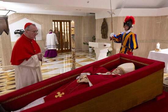 vatican-secretary-of-state-cardinal-pietro-parolin-left-prays-in-front-of-the-body-of-pope-francis-laid-out-in-state-inside-his-private-chapel-at-the-vatican-monday-april-21-2025-vatican-media