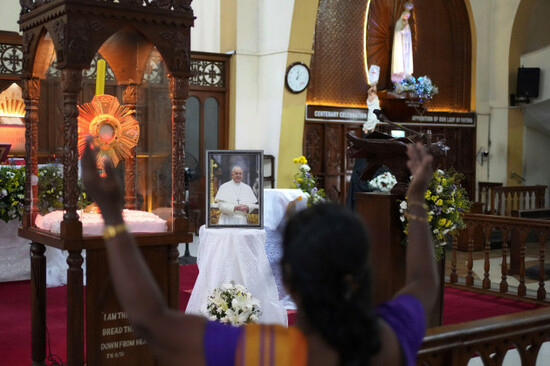 a-catholic-woman-prays-in-front-of-a-portrait-of-pope-francis-at-a-church-in-colombo-sri-lanka-tuesday-april-22-2025-ap-photoeranga-jayawardena