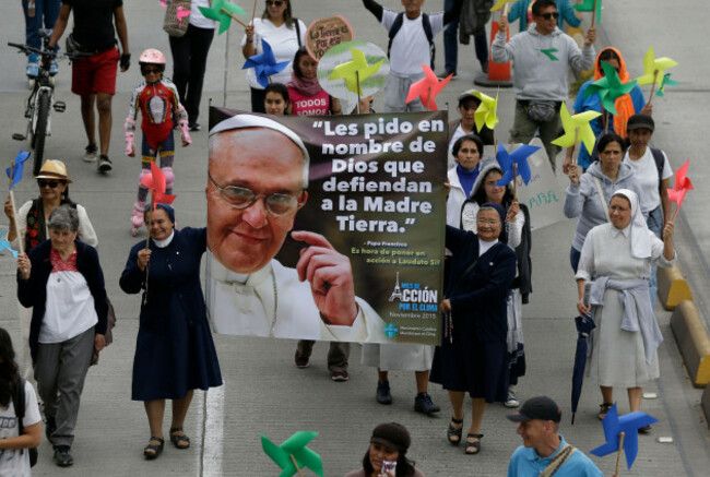 nuns-holds-a-banner-with-a-image-of-pope-francis-that-reads-in-spanish-i-ask-you-in-the-name-of-god-to-defend-mother-earth-during-a-silent-march-calling-for-ambitious-action-to-tackle-climate-chang