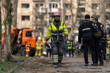 a-firemen-is-seen-walking-away-from-impact-site-after-a-russian-missile-strike-on-ukraines-capital-kyiv-at-least-nine-people-have-been-killed-and-many-more-injured