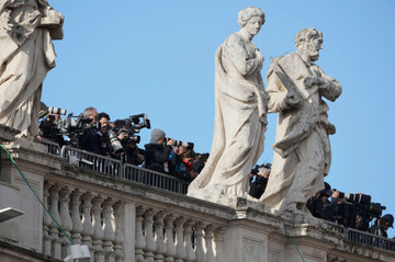 journalists-stand-on-the-colonnade-outside-st-peters-basilica-ahead-of-the-funeral-of-pope-francis-in-st-peters-square-at-the-vatican-saturday-april-26-2025-ap-photoandrew-medichini