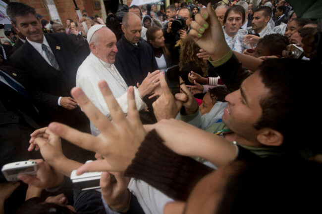 pope-francis-meets-residents-of-the-varginha-slum-in-rio-de-janeiro-brazil-thursday-july-25-2013-francis-on-thursday-visited-one-of-rio-de-janeiros-shantytowns-or-favelas-a-place-that-saw-such