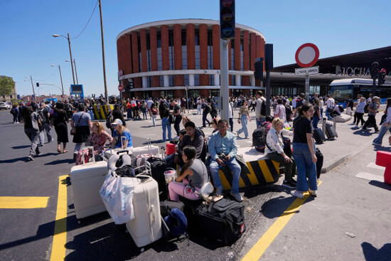 passengers-roam-outside-atocha-train-station-during-a-nationwide-power-outage-in-madrid-monday-april-28-2025-ap-photomanu-fernandez