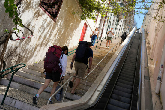 people-climb-stairs-in-lisbon-old-centre-after-the-escalator-stopped-working-following-a-power-outage-monday-april-28-2025-ap-photoarmando-franca