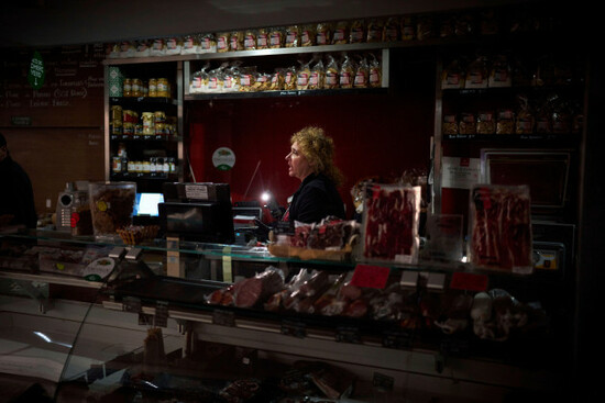 vendors-use-their-phone-light-to-select-and-save-some-food-during-a-major-power-outage-in-barcelona-spain-monday-april-28-2025-ap-photoemilio-morenatti