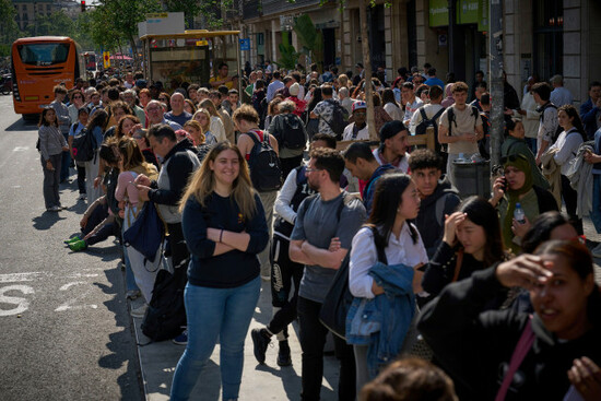 people-wait-outside-a-closed-train-station-during-a-major-power-outage-in-barcelona-spain-monday-april-28-2025-ap-photoemilio-morenatti