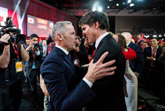 file-mark-carney-leader-of-the-liberal-party-of-canada-embraces-prime-minister-justin-trudeau-after-being-announced-the-winner-at-the-liberal-leadership-event-in-ottawa-ontario-march-9-2025-j