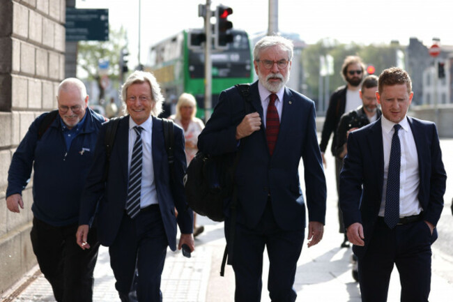 solicitor-paul-tweed-second-left-and-former-sinn-fein-president-gerry-adams-second-right-outside-the-high-court-in-dublin-where-adams-is-bringing-a-legal-action-against-the-bbc-over-allegations-a