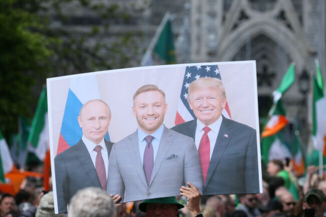 dublin-ireland-26th-april-2025-a-photo-depicting-smiling-vladimir-putin-conor-mcgregor-and-donald-trump-is-held-up-during-the-national-protest-for-ireland-anti-immigration-policy-march-in-dubl