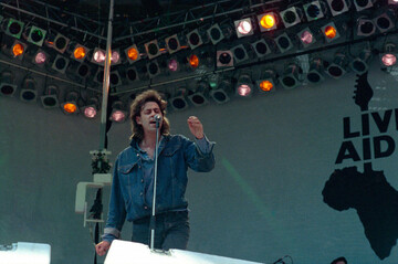 bob-geldof-irish-lead-singer-of-the-boomtown-rats-and-organizer-of-the-live-aid-famine-relief-concert-performs-during-live-aid-at-wembley-stadium-in-london-england-july-131985-ap-photo