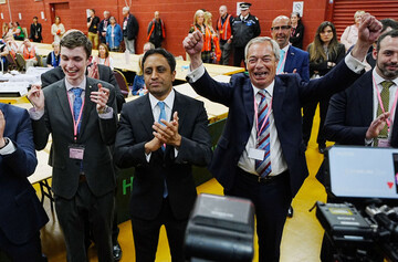 reform-uk-leader-nigel-farage-right-and-chair-zia-yusuf-centre-celebrate-for-the-media-after-reform-candidate-sarah-pochin-won-the-runcorn-and-helsby-by-election-at-dcbl-halton-stadium-widnes-ch