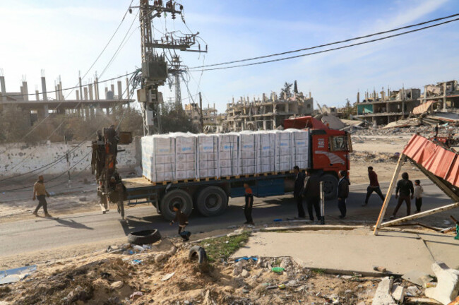 humanitarian-aid-trucks-enter-through-the-kerem-shalom-crossing-from-egypt-into-the-gaza-strip-as-a-ceasefire-deal-between-israel-and-hamas-went-into-effect-sunday-jan-19-2025-ap-photomariam-d