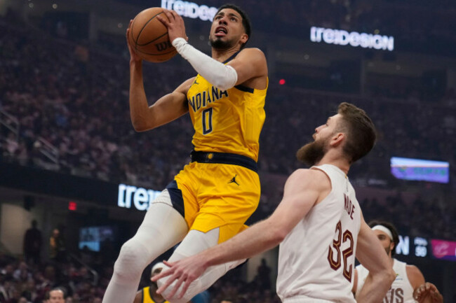 indiana-pacers-tyrese-haliburton-0-goes-to-the-basket-in-front-of-cleveland-cavaliers-dean-wade-32-in-the-first-half-during-game-1-in-the-eastern-conference-semifinals-of-the-nba-basketball-play