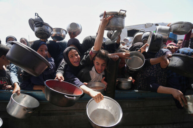 palestinians-struggle-to-get-donated-food-at-a-community-kitchen-in-khan-younis-gaza-strip-monday-may-5-2025-ap-photoabdel-kareem-hana