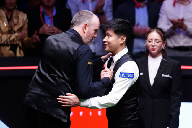 mark-williams-left-congratulates-zhao-xintong-after-the-final-match-following-day-seventeen-of-the-halo-world-snooker-championship-at-the-crucible-theatre-sheffield-picture-date-monday-may-5-202