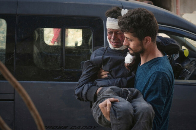 a-boy-wounded-during-an-israeli-army-strike-is-carried-into-the-al-shifa-hospital-in-gaza-city-monday-may-5-2025-ap-photojehad-alshrafi