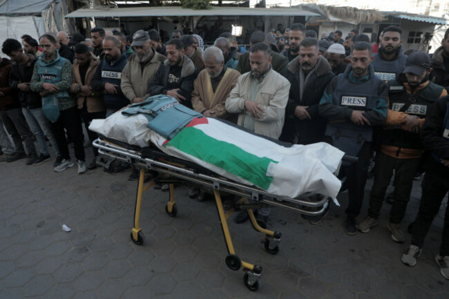 241216-gaza-dec-16-2024-xinhua-people-attend-a-funeral-of-journalist-ahmed-al-louh-at-a-hospital-in-deir-al-balah-central-gaza-strip-on-dec-16-2024-at-least-25-palestinians-were-kill