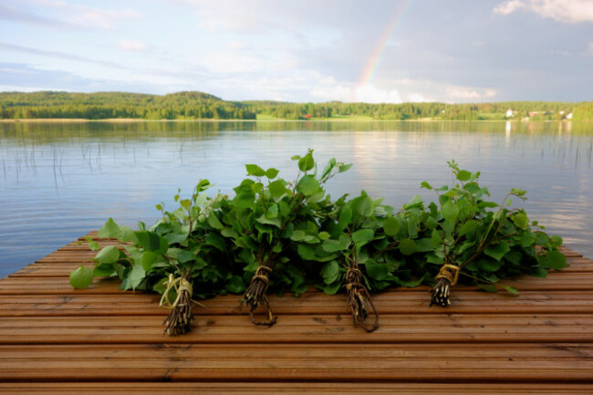 traditional-finnish-sauna-whisks-on-a-jetty-by-the-lake