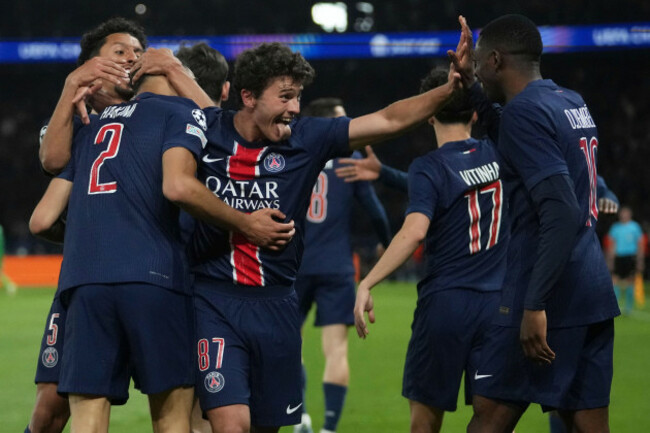 psgs-achraf-hakimi-left-celebrates-with-teammates-after-scoring-his-sides-second-goal-during-the-champions-league-semifinal-second-leg-soccer-match-between-paris-saint-germain-and-arsenal-at-the-p