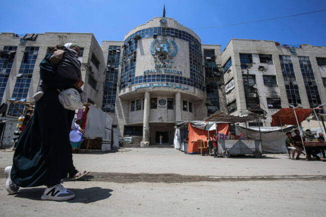 displaced-palestinians-sit-by-their-makeshift-tents-outside-the-unrwa-run-clinic-displaced-palestinians-sit-by-their-makeshift-tents-outside-the-unrwa-run-clinic-at-al-shati-refugee-camp-west-of-gaza
