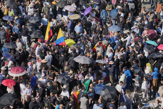 people-wait-at-st-peters-square-at-the-vatican-where-133-cardinals-gather-on-the-second-day-of-the-conclave-to-elect-successor-of-late-pope-francis-thursday-may-8-2025-ap-photomarkus-schreiber