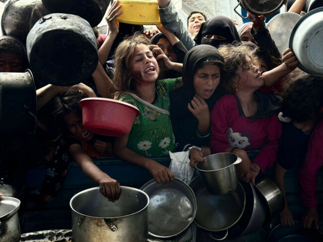 long-queues-formed-during-the-distribution-of-food-by-an-aid-organization-in-khan-yunis-long-queues-formed-during-the-distribution-of-food-by-an-aid-organization-in-khan-yunis-on-may-02-2025-palest