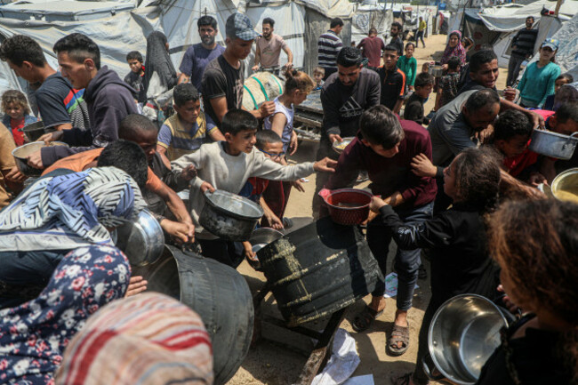 gaza-9th-may-2025-palestinians-receive-free-food-from-a-food-distribution-center-in-gaza-city-on-may-9-2025-credit-rizek-abdeljawadxinhuaalamy-live-news