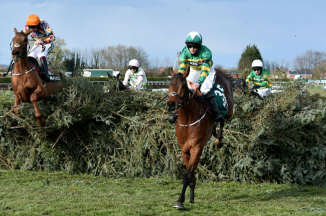 rachael-blackmore-ridding-minella-times-center-right-clears-the-last-fence-to-win-the-randox-grand-national-handicap-chase-on-the-third-day-of-the-grand-national-horse-racing-meeting-at-aintree-race