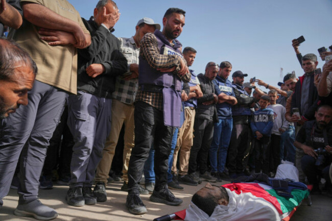 adds-context-mourners-pray-over-the-body-of-palestinian-journalist-hassan-eslaiah-who-was-killed-in-an-overnight-israeli-strike-on-nasser-hospital-with-the-israeli-military-claiming-he-was-targete