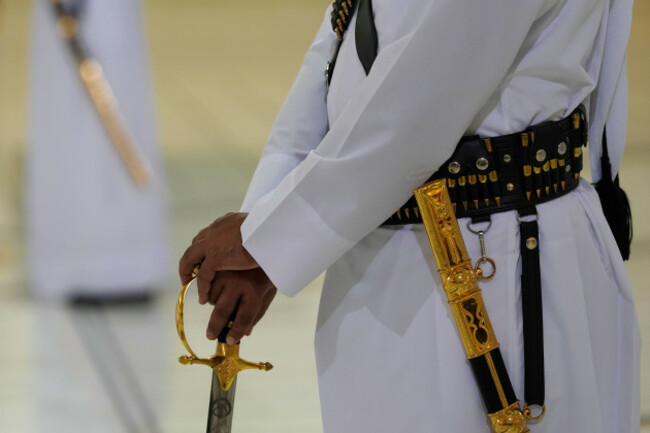 qatari-honor-guard-with-their-golden-swords-wait-for-the-arrival-of-president-donald-trump-during-an-official-welcoming-ceremony-at-the-amiri-diwan-in-doha-qatar-wednesday-may-14-2025-ap-photo
