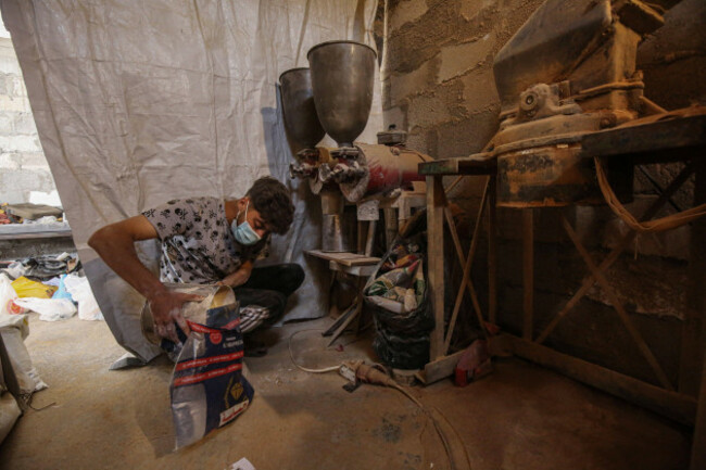 palestinians-hold-ground-lentils-to-be-used-as-a-replacement-for-flour-during-a-shortage-at-a-mill-in-the-jabalia-camp-palestinians-hold-ground-lentils-to-be-used-as-a-replacement-for-flour-during-a-s
