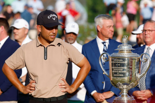 louisville-ky-may-19-xander-schauffele-looks-at-the-wanamaker-trophy-before-the-official-presentation-for-winning-the-pga-championship-may-19-2024-at-valhalla-golf-club-in-louisville-kentucky