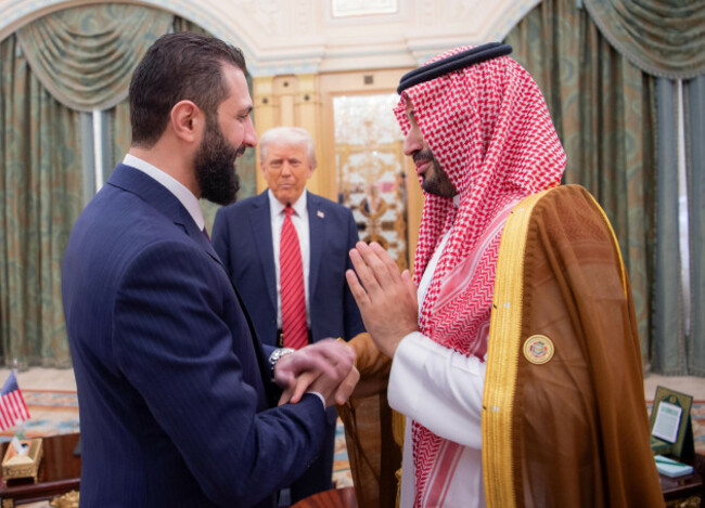 riyadh-saudi-arabia-14th-may-2025-saudi-crown-prince-mohammed-bin-salman-r-greeting-syrias-interim-president-ahmed-al-sharaa-l-as-us-president-donald-trump-c-looks-on-in-riyadh-in-saudi-ar