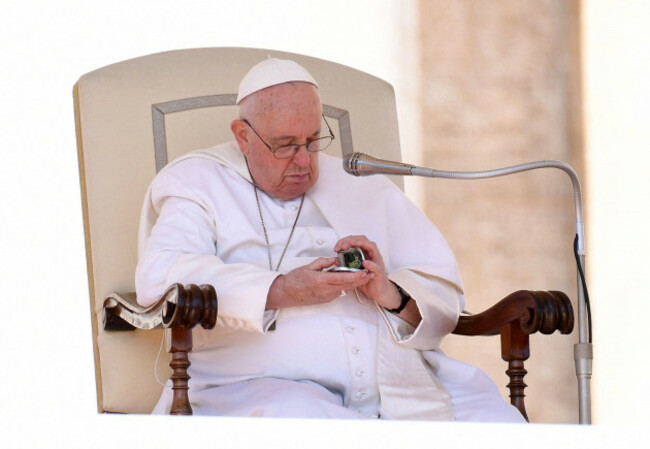 vatican-march-15-2023-pope-francis-checks-his-phone-during-the-weekly-general-audience-in-saint-peters-square-at-the-vatican-on-march-15-2023-photo-by-eric-vandevilleabacapress-com-credit-abac