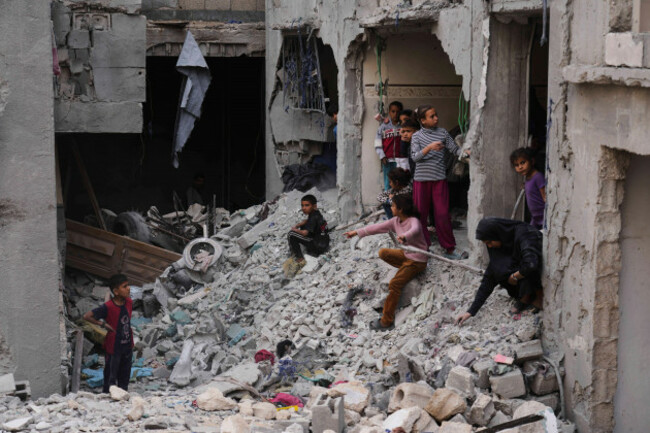 palestinians-inspect-the-rubble-of-the-al-lahham-familys-home-destroyed-by-israeli-airstrikes-in-khan-younis-gaza-strip-on-thursday-may-15-2025-ap-photoabdel-kareem-hana