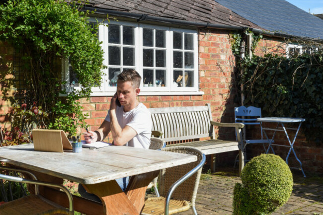man-working-from-home-remote-working-online-in-the-garden