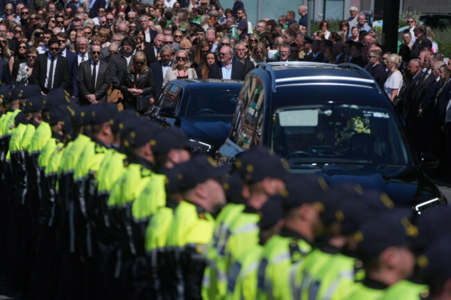 garda-officers-line-the-route-as-the-funeral-cortege-for-garda-officer-kevin-flatley-arrives-at-st-peter-and-pauls-church-balbriggan-co-dublin-the-officer-died-when-he-was-struck-by-a-motorcycle