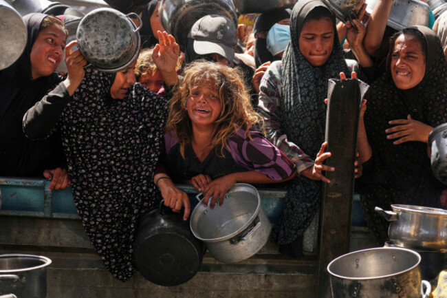 palestinians-struggle-to-get-donated-food-at-a-community-kitchen-in-khan-younis-gaza-strip-friday-may-16-2025-ap-photoabdel-kareem-hana