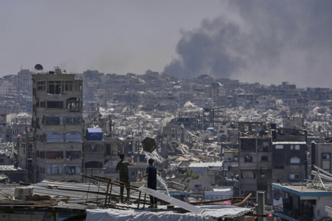 palestinians-look-at-smoke-rises-following-an-israeli-airstrike-near-jabalia-northern-gaza-strip-friday-may-16-2025-ap-photojehad-alshrafi
