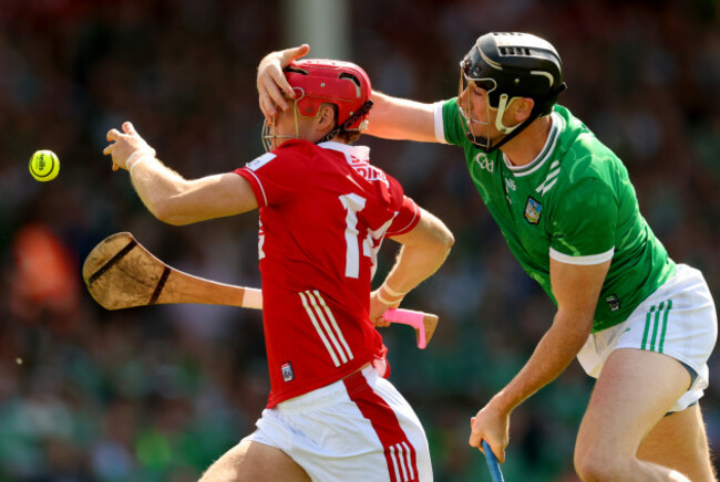 alan-connolly-has-his-helmet-tugged-by-diarmaid-byrnes