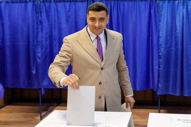 george-simion-leader-of-the-right-wing-alliance-for-the-union-of-romanians-party-or-aur-casts-his-vote-in-the-countrys-parliamentary-elections-in-focsani-romania-sunday-dec-1-2024-ap-photo