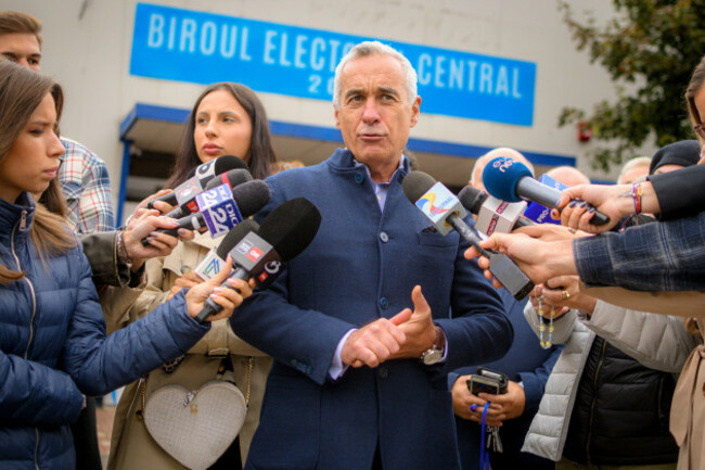 calin-georgescu-running-as-an-independent-candidate-for-president-speaks-to-media-after-registering-his-bid-in-the-countrys-presidential-elections-in-bucharest-romania-tuesday-oct-1-2024-ap