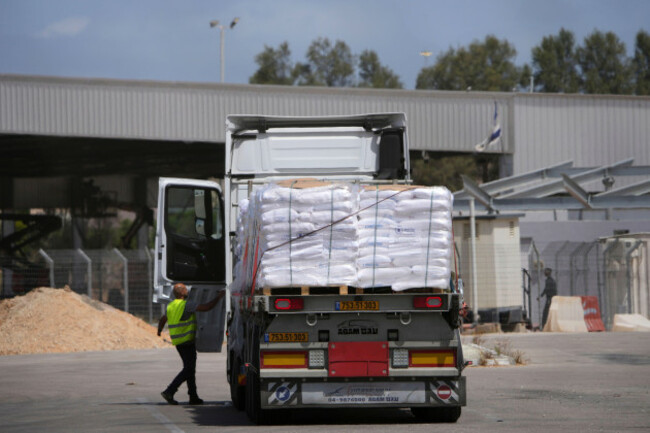 trucks-carrying-humanitarian-aid-for-the-gaza-strip-are-seen-at-the-kerem-shalom-crossing-in-southern-israel-monday-may-19-2025-a-day-after-israel-said-it-would-resume-allowing-aid-into-the-territ
