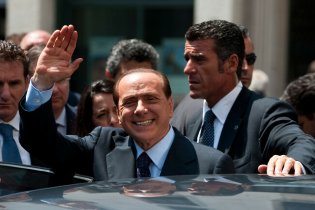 minister-silvio-berlusconi-leaving-the-opening-session-of-the-med-forum-2010-on-july-12-2010-in-milan-italy