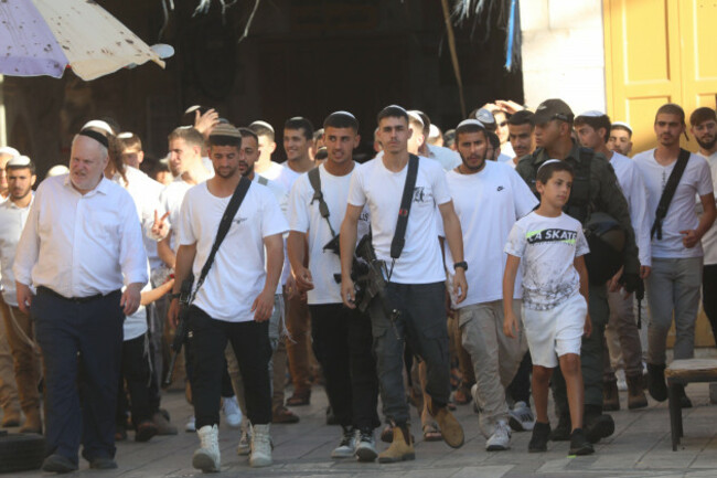 a-group-of-jewish-settlers-under-the-protection-of-israeli-soldiers-raids-the-old-city-area-of-hebron-a-group-of-jewish-settlers-under-the-protection-of-israeli-soldiers-raids-the-old-city-area-of-heb