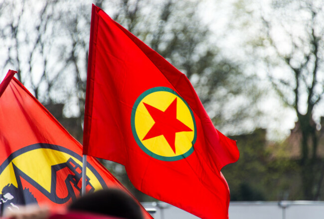 hamburg-germany-10th-apr-2016-participants-carry-a-flag-of-the-banned-kurdistan-workers-party-pkk-during-counterprotests-by-kurds-and-left-wing-groups-in-hamburg-germany-10-april-2016-the-de