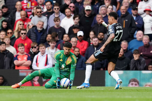 aston-villas-morgan-rogers-right-kicks-the-ball-away-from-manchester-united-goalkeeper-altay-bayindir-before-scoring-only-for-the-goal-to-be-disallowed-by-referee-thomas-bramall-during-the-premier